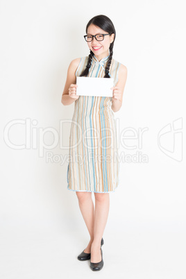 Asian woman holding white blank paper card