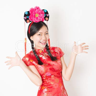 Oriental woman in red cheongsam