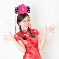 Oriental woman in red cheongsam