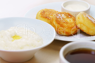 Breakfast with rice porridge and cheese pancakes