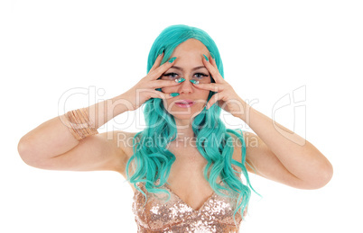 Woman holding finger over eyes.