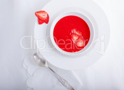 Strawberry soup with white napkin.