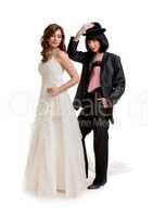 Female gay couple dressed like groom and bride standing