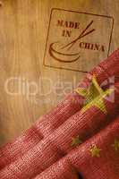 Chinese flag and made in China with chopsticks