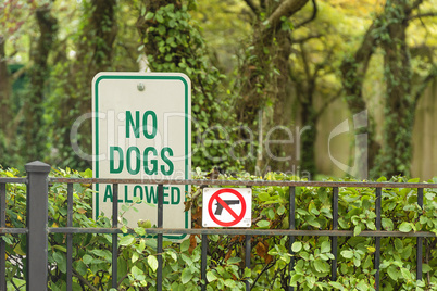 No Dogs and  guns Allowed Sign