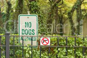 No Dogs and  guns Allowed Sign