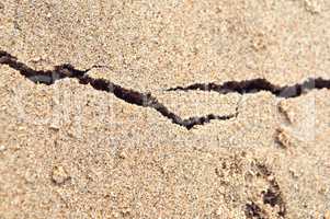 the crack on the sand, sea sand, shore sand, colored sand