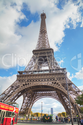 Eiffel tower surrounded by tourists
