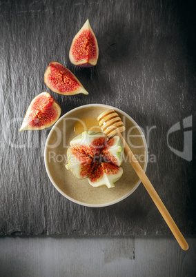 Fresh fig on the plate with honey