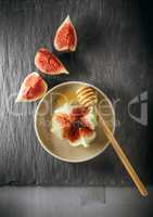 Fresh fig on the plate with honey