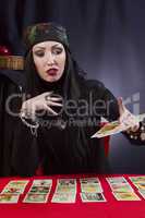 Gypsy woman wonders on Tarot cards