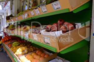 Display of boxes of fresh fruit to be sold.