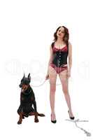 Woman in lingerie holding dog on metal chain