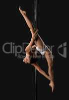 Young girl hanging in split upside down on pylon