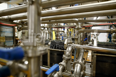 Dairy plant equipment at work close up shot