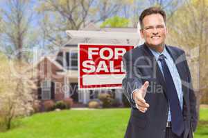 Male Agent Reaching for Hand Shake in Front of House and For Sal