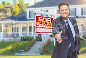 Male Agent Reaching for Hand Shake in Front of House and Sold Re