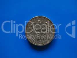 One Pound (GBP) coin, United Kingdom (UK) over blue