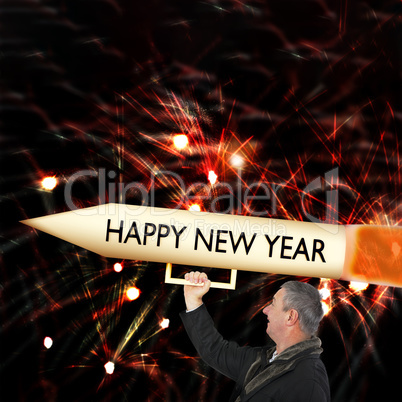 Man with big New Year's Eve rocket at the turn of the year