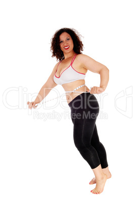 Exercise woman measuring her stomach.