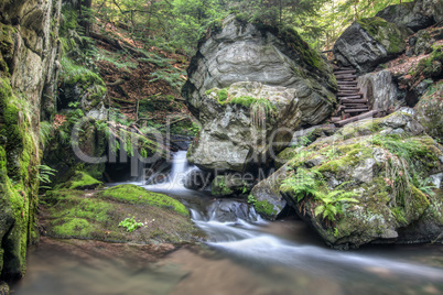 Stone guardian of the waterfalls - bizarre boulder on the bank