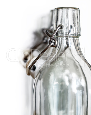 Neck of glass bottles with a porcelain stopper
