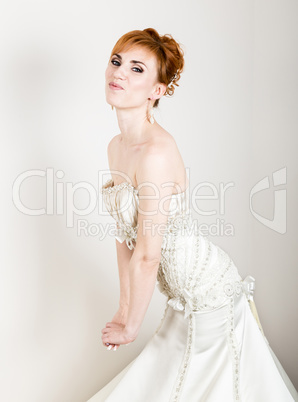 Beautiful Young Redhead Bride Wearing White Wedding Dress