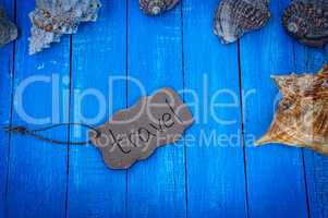 Blue wooden background with shells