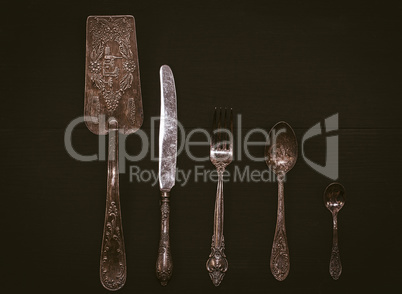 Kitchen accessories on a black wooden surface