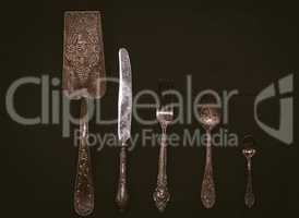 Kitchen accessories on a black wooden surface