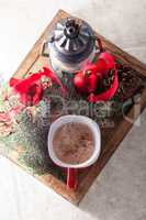 Christmas cocoa in mug on the wooden tray