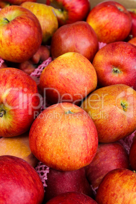 Yummy pile of apples in a market stall.