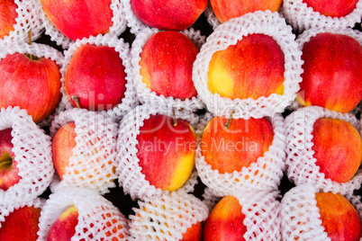 Yummy pile of apples in a market stall.