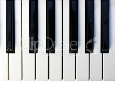 Closeup detail of a piano keyboard.