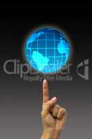Concept hand pointing earth globe.