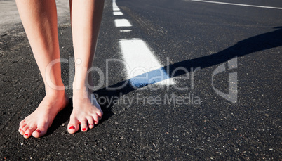 Barefoot girl on the road