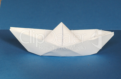 paper boat over blue