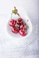 Cherries in a white dish