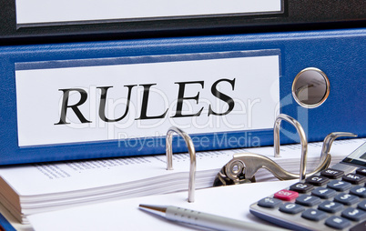 Rules binder on desk in the office