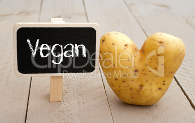 Vegan Chalkboard with heart shaped Potato