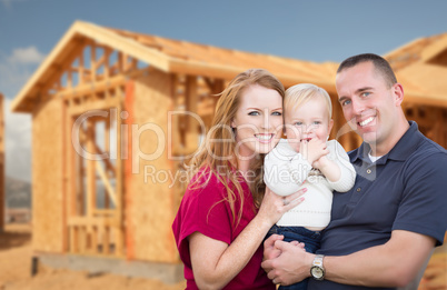 Young Military Family Outside Their New Home Framing