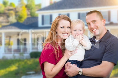 Young Military Family in Front of Their House