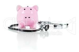 Piggy Bank and Stethoscope Isolated on White
