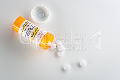 Non-Proprietary Medicine Prescription Bottle and Spilled Pills