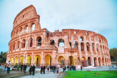 The Colosseum with people at night