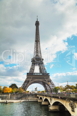 Eiffel tower surrounded by tourists