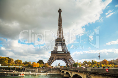 Eiffel tower surrounded by tourists