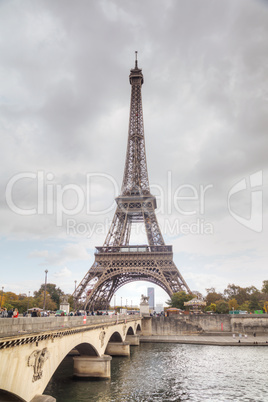 Eiffel tower surrounded by tourists