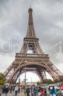 Eiffel tower surrounded by tourists