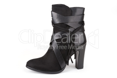 Black ankle boot with a tassel isolated on white